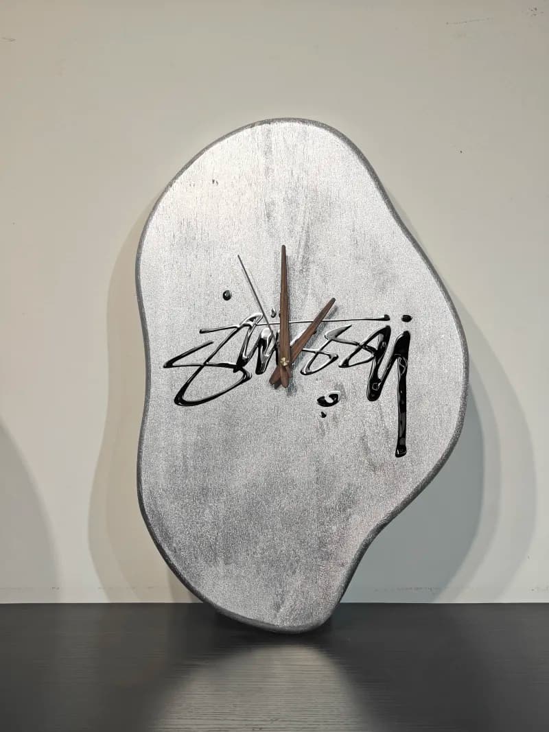 Stüssy Abstract Wall Clock Silver Metallic with Signature Logo