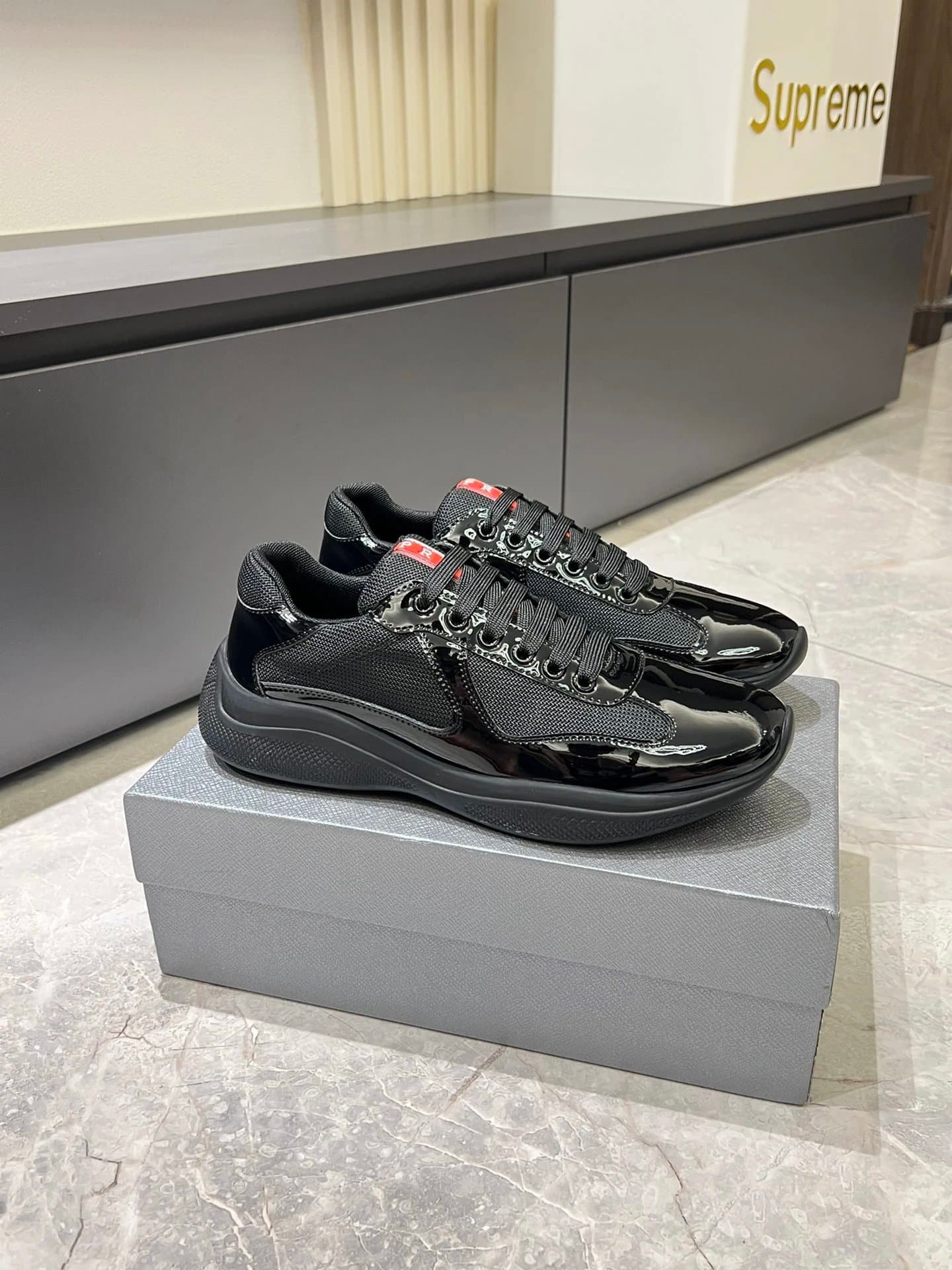 Prada × Supreme Cloudbust Thunder White Black Red — 01