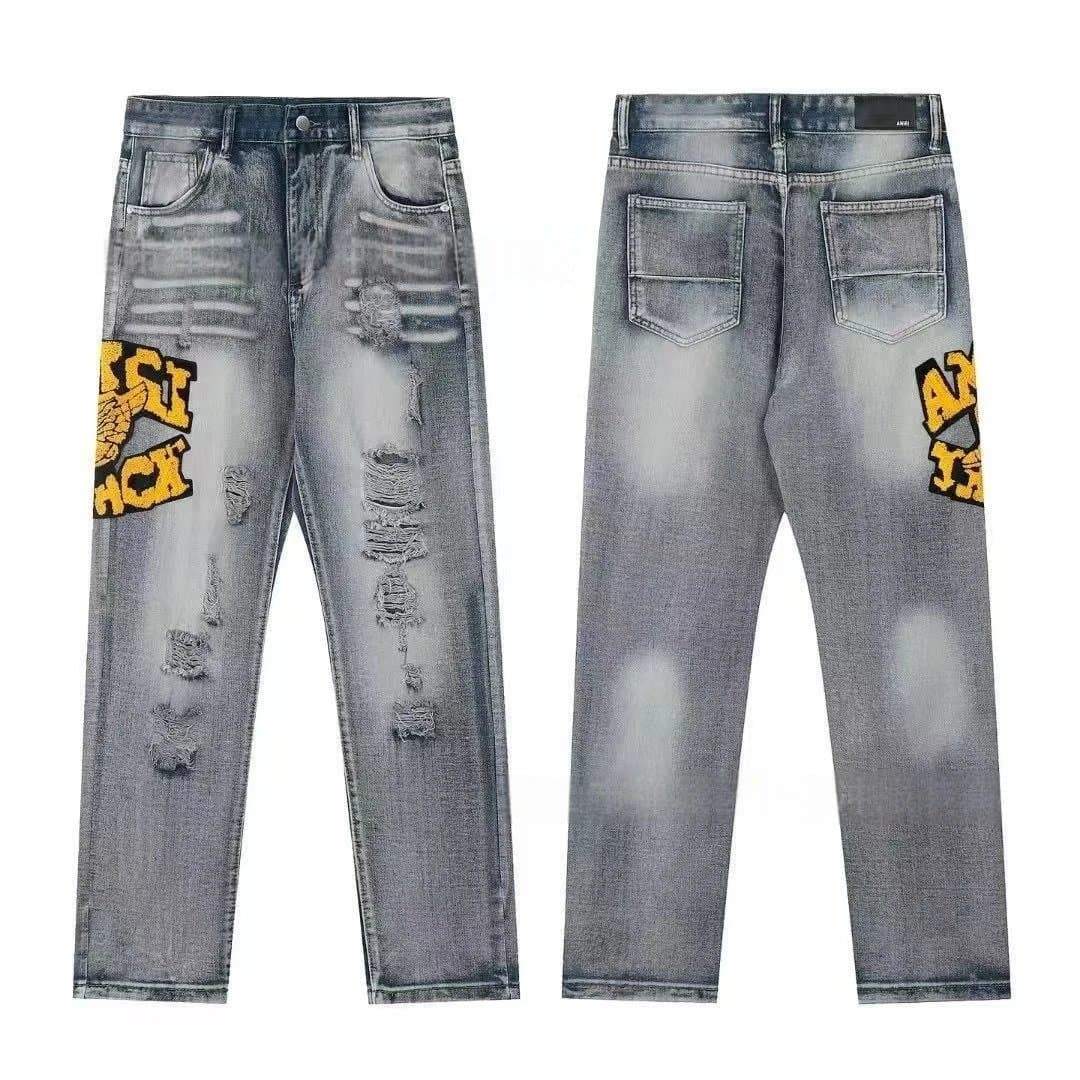 Amiri Distressed Jeans Patchwork Logo