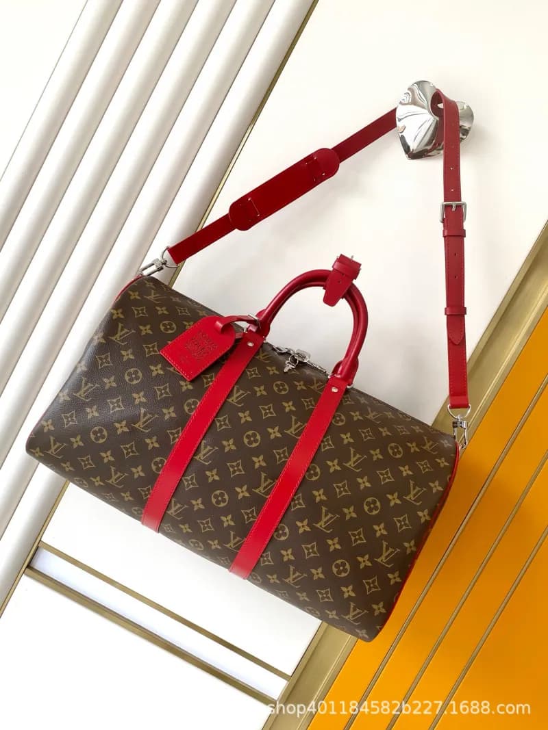 Louis Vuitton Keepall Monogram Canvas with Red Leather Trim