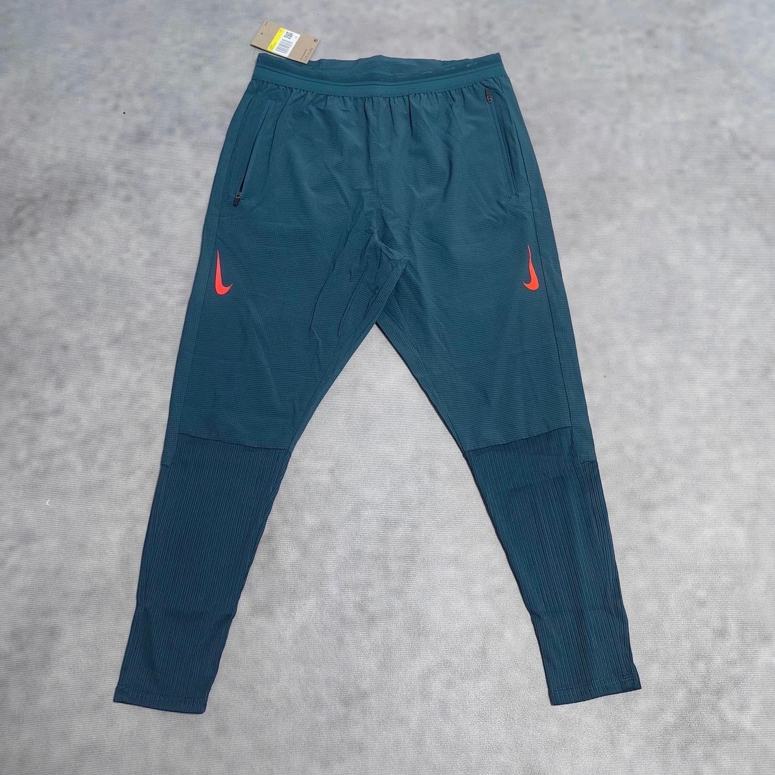 Nike Tech Knit Pants Deep Teal with Orange Swoosh