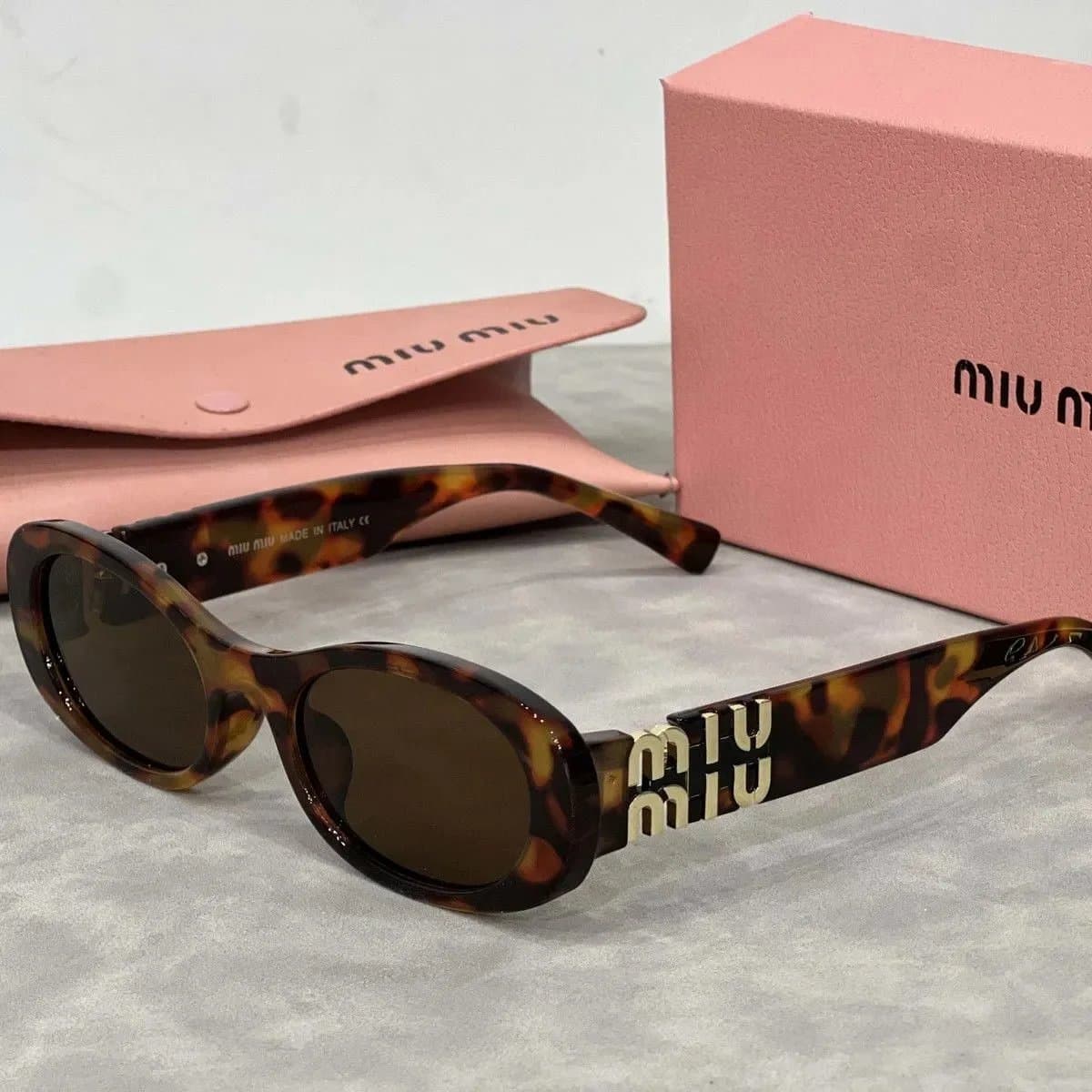Miu Miu Oval Sunglasses Tortoiseshell with Logo Temples
