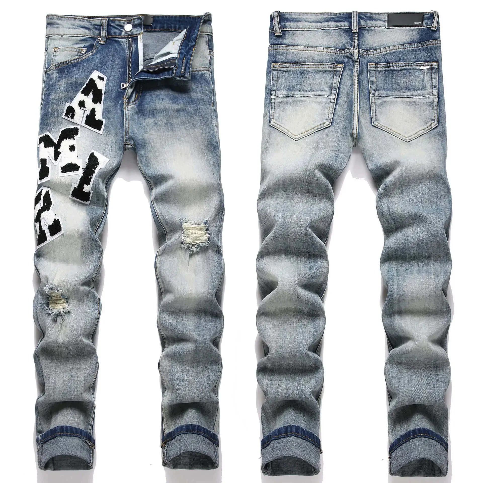 Amiri Distressed Denim Jeans Cow Print Patch