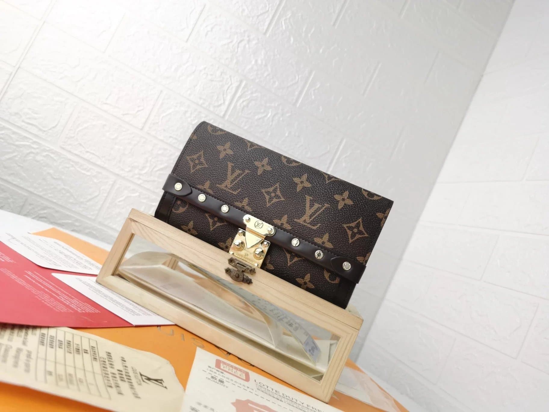 Louis Vuitton Lockit Clutch Monogram Canvas