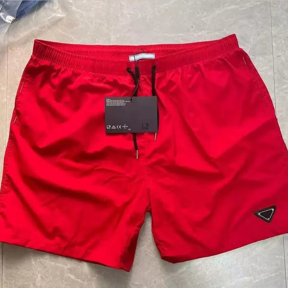 Prada Triangle Logo Shorts Beige with Black Triangle Patch — A24