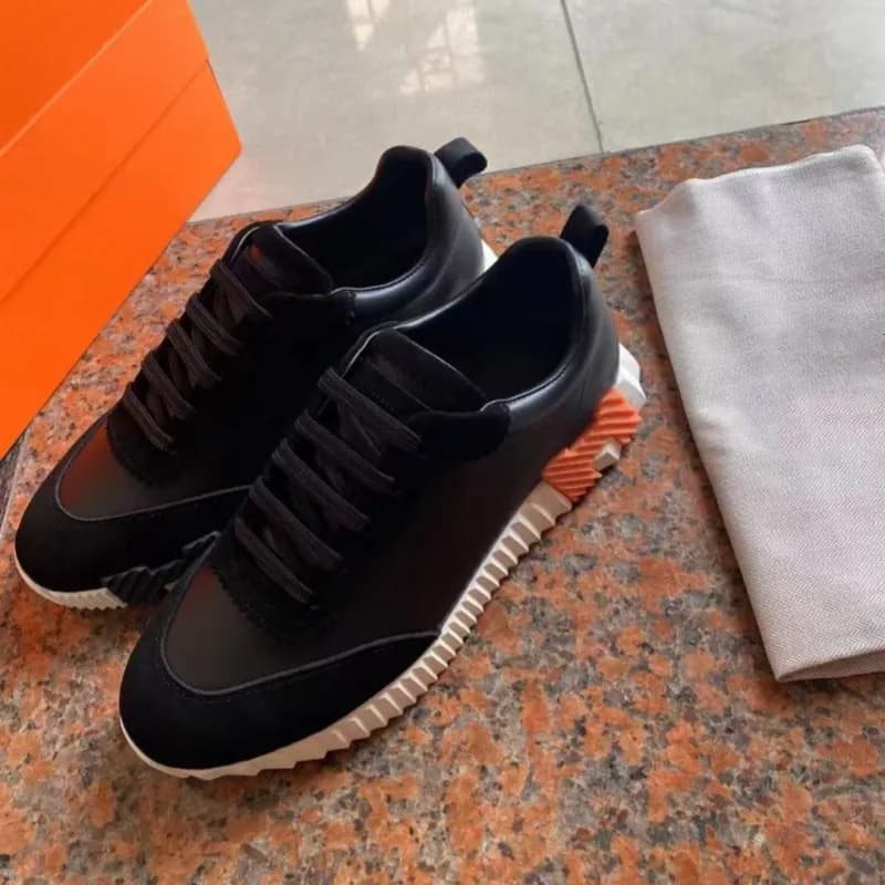 Hermès Oran Sneaker Black Suede and Leather with Orange Sole