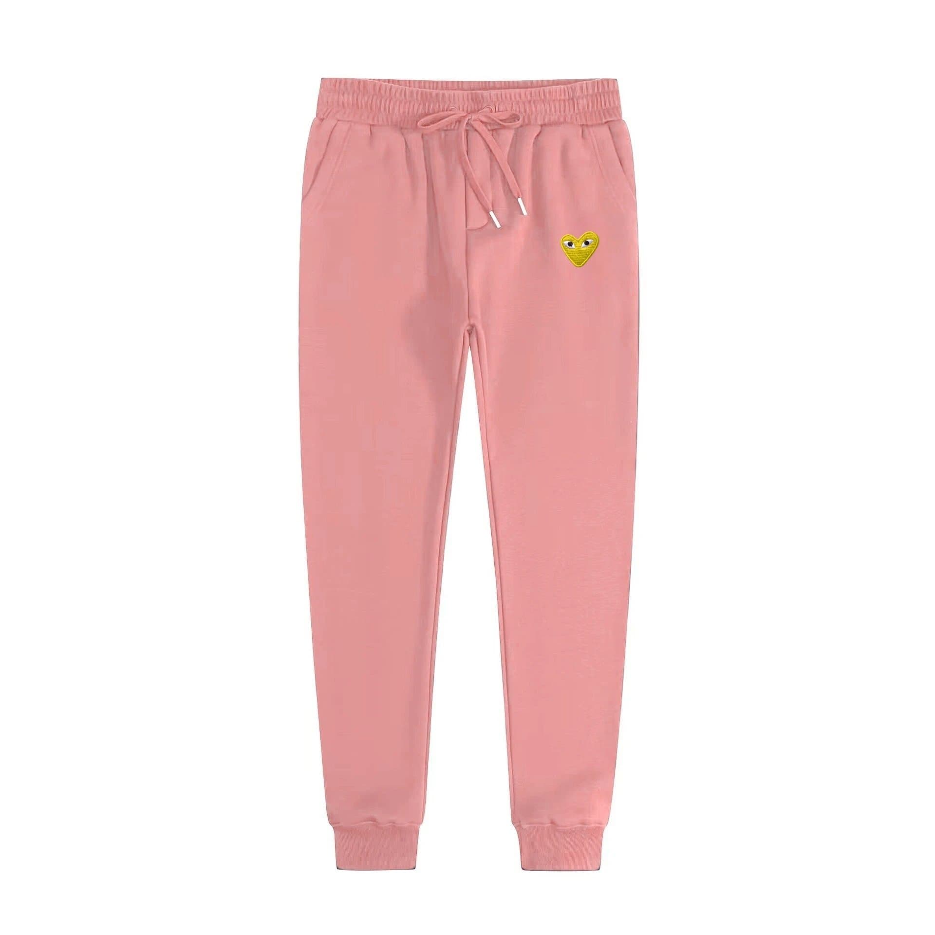 Comme des Garçons Jogger Pants Heart Logo — 卫裤粉色金眼
